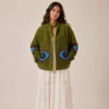 Lakshmi Jacket. Color verde manzana con ojo protector